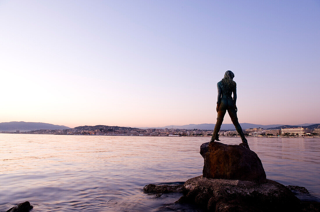 France, Alpes Maritimes, Cannes, the Croisette at nightfall, mermaid Atlante, guarding Port Canto, by sculptor Amaryllis Bataille