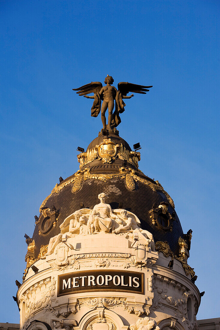 Spain, Madrid, the angel of the Metropolis building on the Gran Via avenue