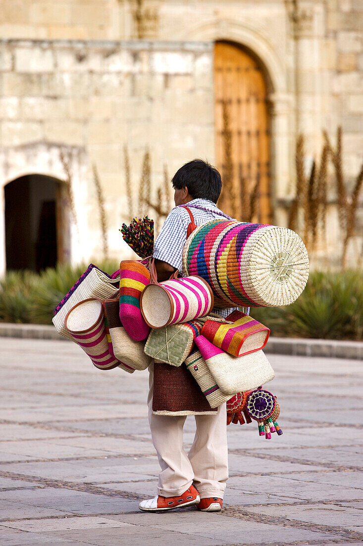 Mexico, Oaxaca State, Oaxaca City, historical colonial centre listed as World Heritage by UNESCO, baskets salesman