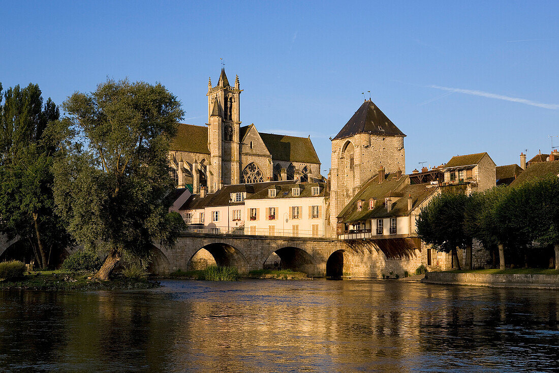 France, Seine et Marne, Moret on Loing, Loing River, Porte de Bourgogne (Gate of Burgundy) and Notre Dame de la Nativite Church
