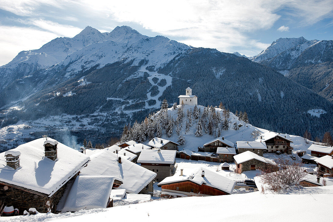 France, Savoie, Montvalezan, the Chatelard 1550m and the chapel of Saint Michel, High Tarentaise overlooking the National Park of La Vanoise and Les Arcs ski area and the nature reserve of high Villaroger