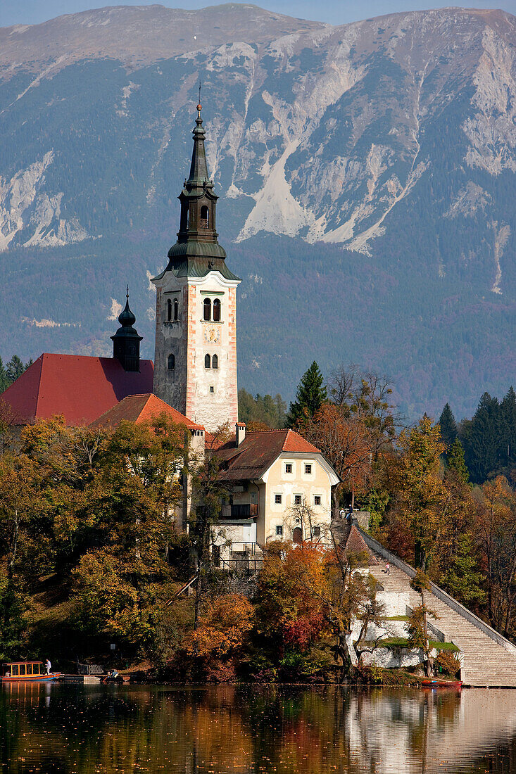 Slovenia, Gorenjska region, on the island of the Bled lake, church of the Assumption with the Julian Alps in the background