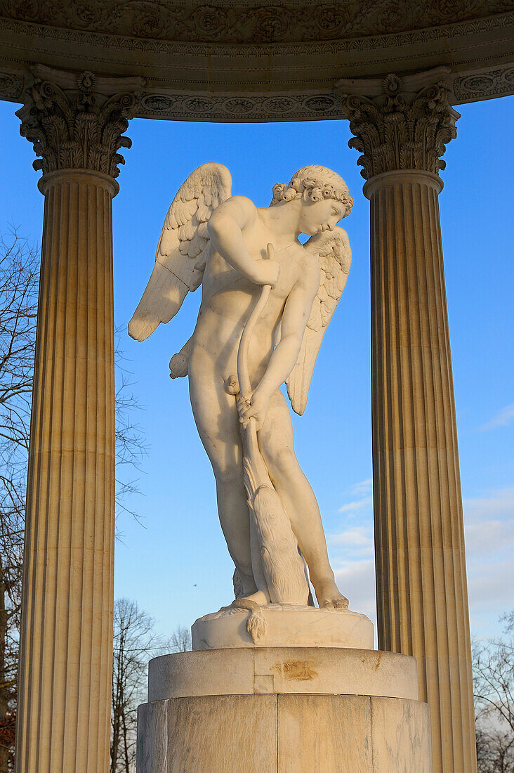 France, Yvelines, Chateau de Versailles, listed as World Heritage by UNESCO, Domaine de Marie Antoinette, the Petit Trianon Garden, the Love Temple, statue by Bouchardon called Cupid Cutting His Bow from the Club of Hercules