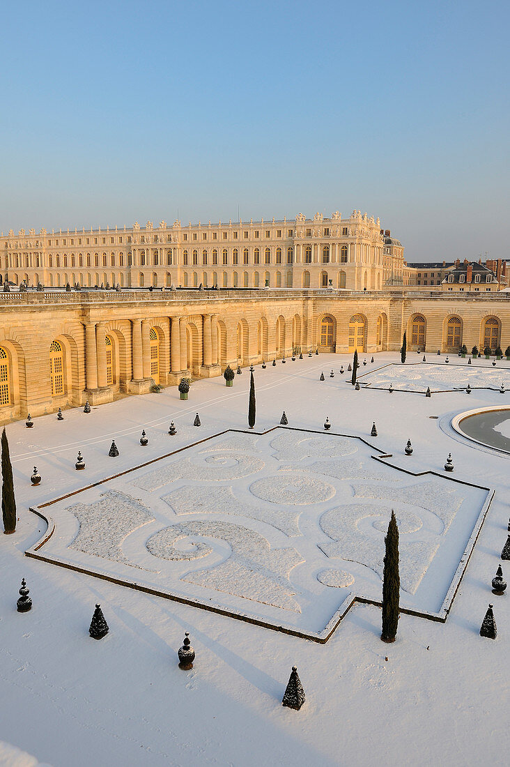 France, Yvelines, snow covered park of the Chateau de Versailles, listed as World Heritage by UNESCO, Orangery and its bed