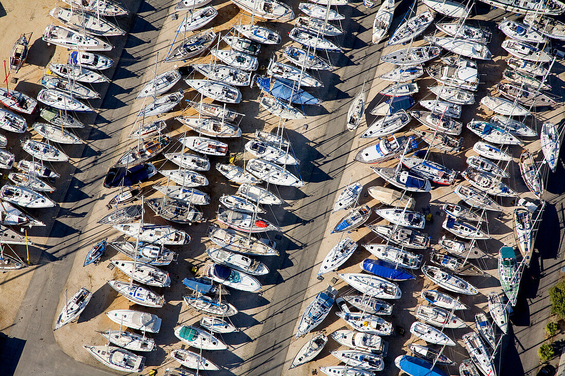 France, Bouches du Rhone, Camargue, dry harbour for boats and sailing boats at Port Saint Louis du Rhone (aerial view)