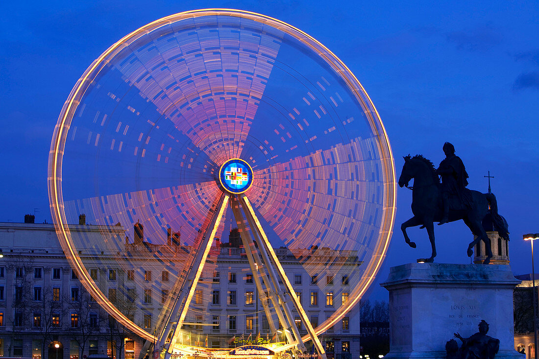 France, Rhone, Lyon, historical site listed as World Heritage by UNESCO, the great wheel on place Bellecour (Bellecour Square) and equestrian statue of Louis XIV