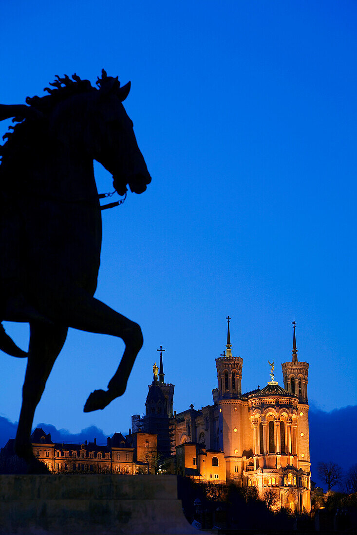 France, Rhone, Lyon, historical site listed as World Heritage by UNESCO, equestrian statue of Louis XIV on place Bellecour (Bellecour Square) and Notre Dame de Fourviere Basilica