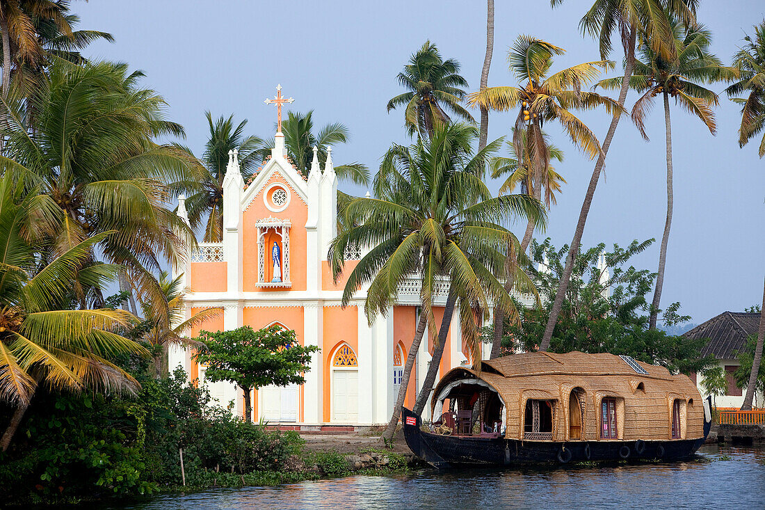 India, Kerala State, Allepey, Backwaters Region, houseboat in front of catholic church