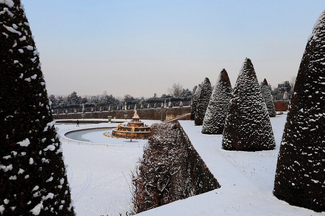 France, Yvelines, snow covered park of the Chateau de Versailles, listed as World Heritage by UNESCO, the Latona Basin