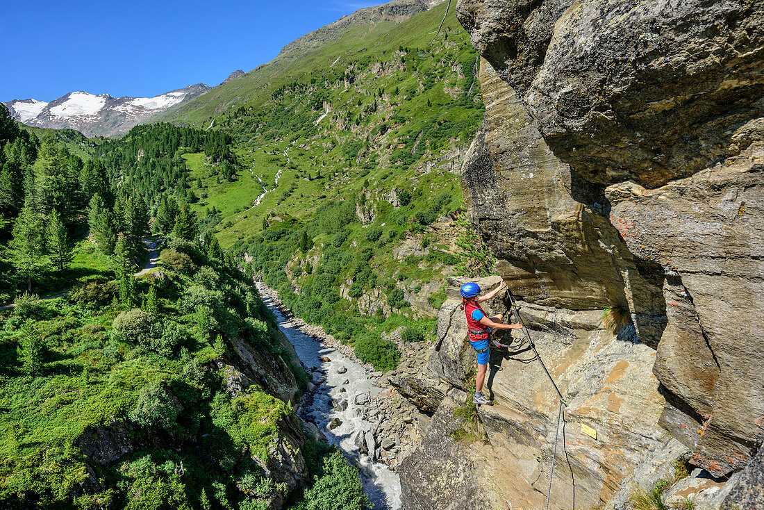 Woman climbing on Obergurgler Klettersteig, fixed-rope route, Obergurgler Klettersteig, Obergurgl, Oetztal Alps, Tyrol, Austria