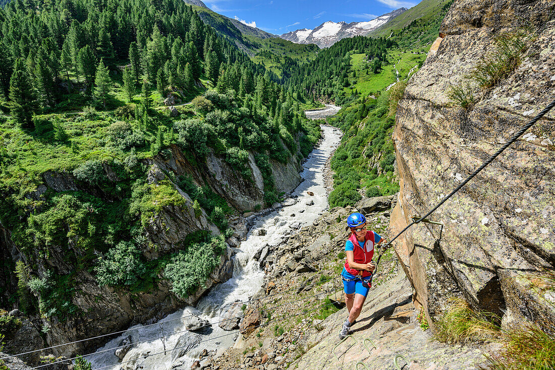 Woman climbing on Obergurgler Klettersteig, fixed-rope route, Obergurgler Klettersteig, Obergurgl, Oetztal Alps, Tyrol, Austria