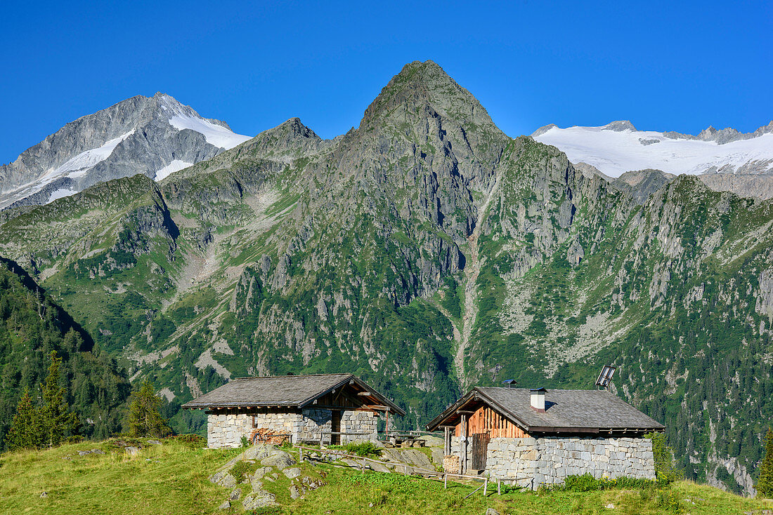 Two alpine huts with Monte Care Alto and Monte Ospedale in background, Val Genova, Adamello-Presanella Group, Trentino, Italy