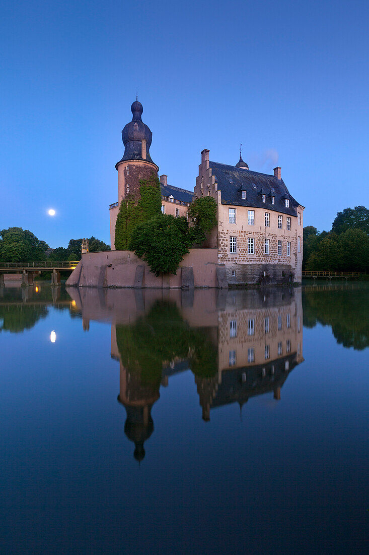 Moon reflecting in the moat, Gemen moated castle, Borken, Muensterland, North-Rhine Westphalia, Germany