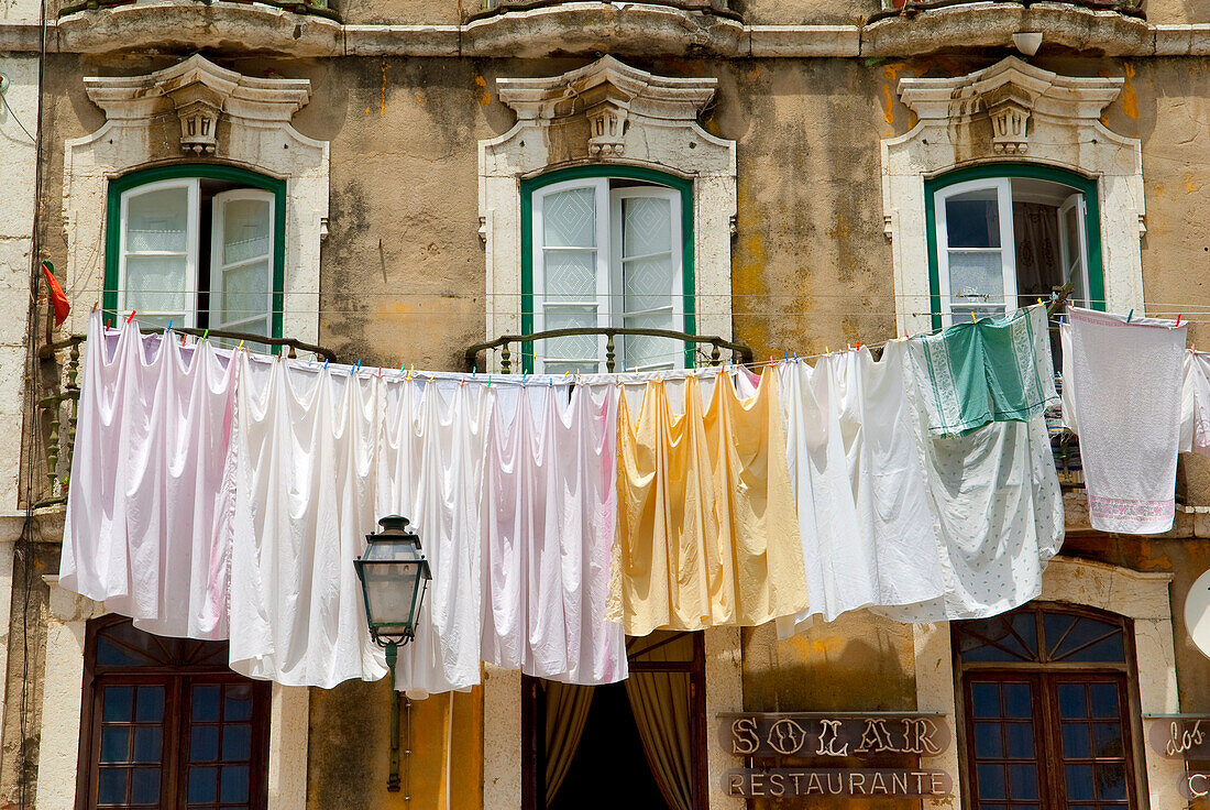 Portugal, Lisbon, Alfama District, clothes hanged along the Rua dos Bocalhoeiros