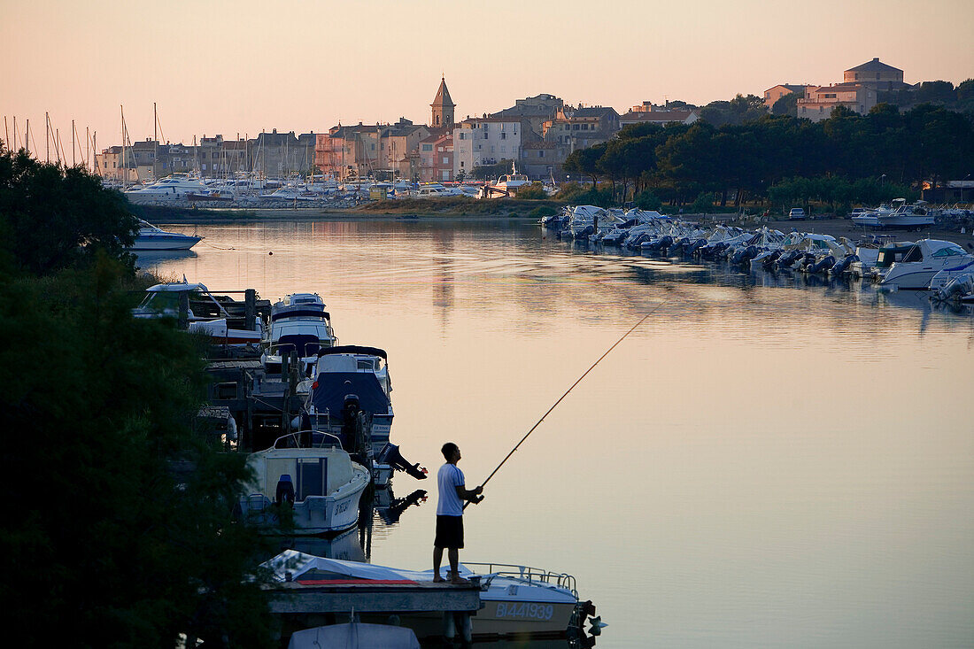 France, Haute Corse, Saint Florent, fisherman on the Aliso river