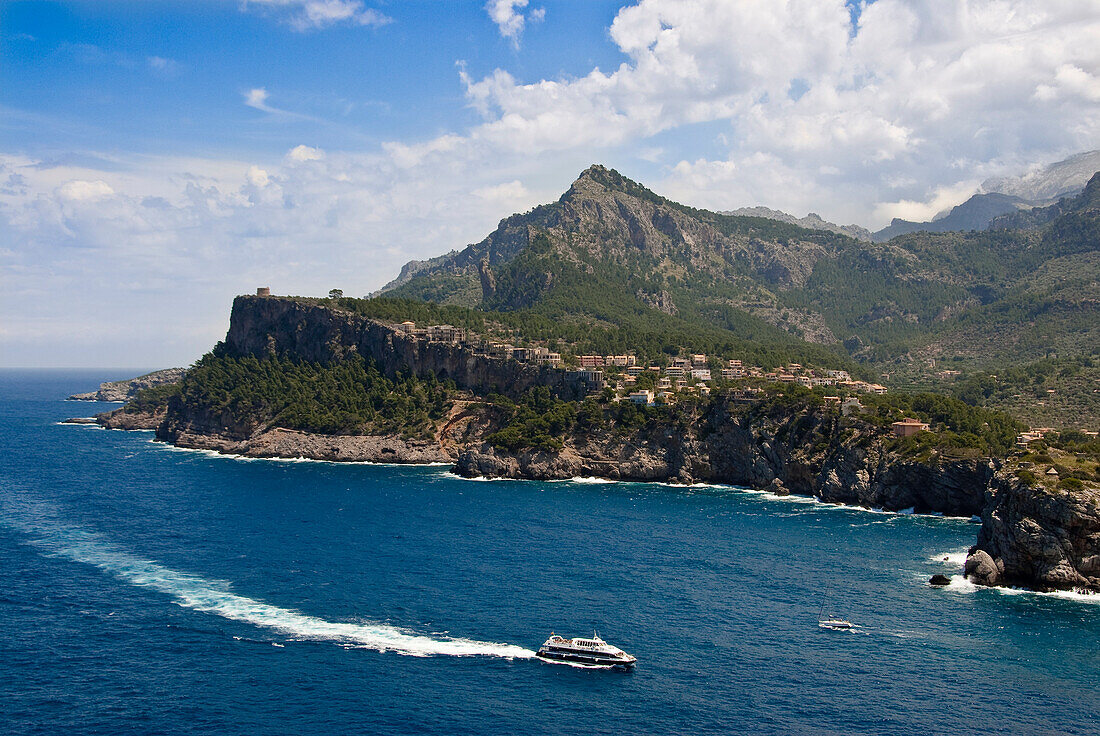 Spain, Balearic Islands, Majorca, Puerto Soller, looking down on the coast and lighthouse