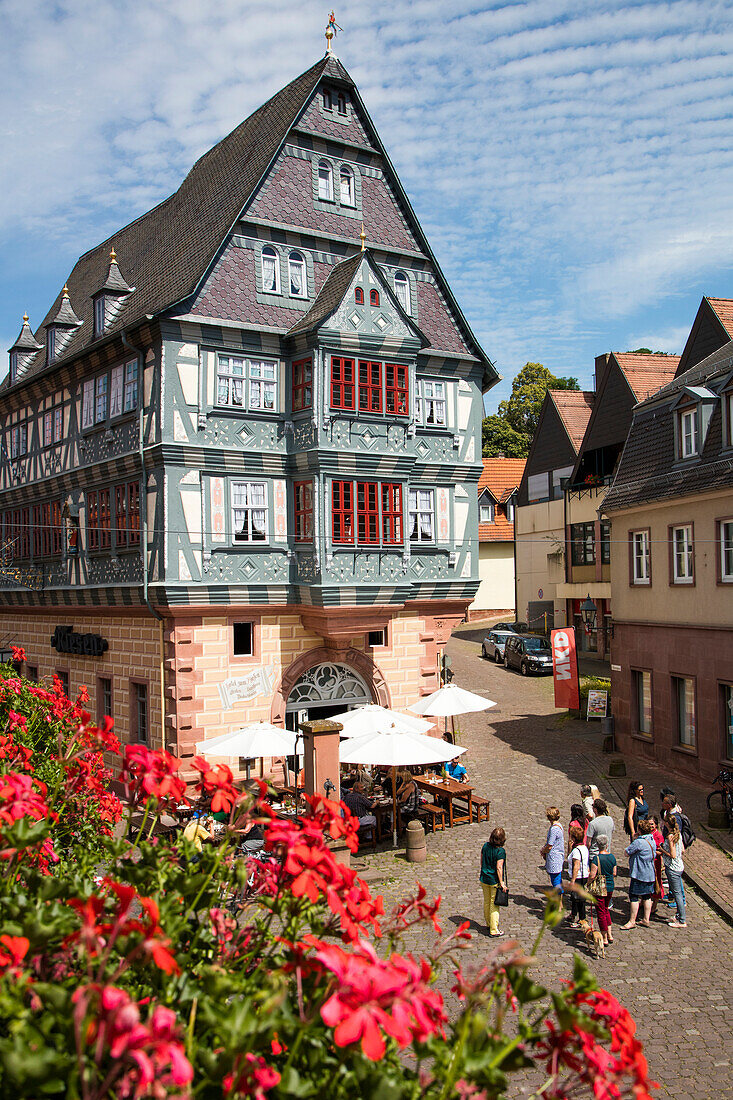 People outside Hotel Gasthaus Zum Riesen (Germany's oldest restaurant), Miltenberg, Spessart-Mainland, Bavaria, Germany