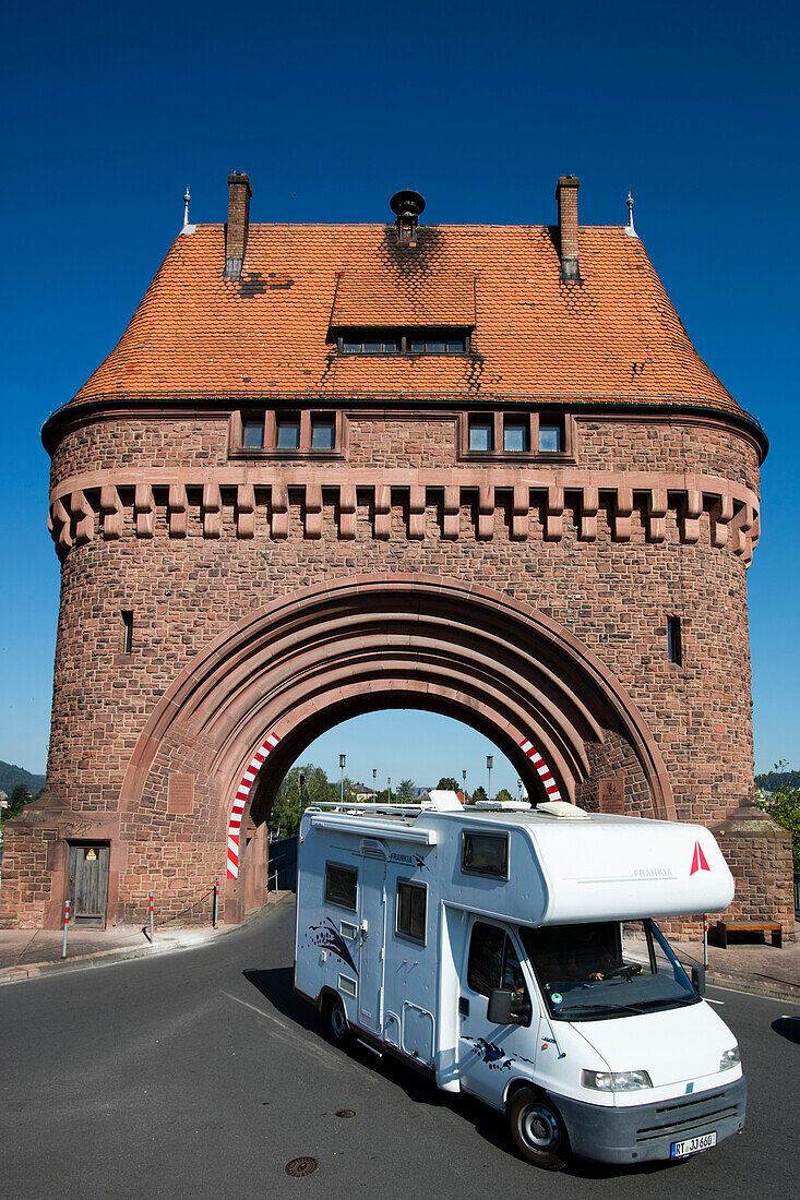 Motorhome passes through Torhaus town gate on Mainbruecke bridge across Main river, Miltenberg, Spessart-Mainland, Bavaria, Germany