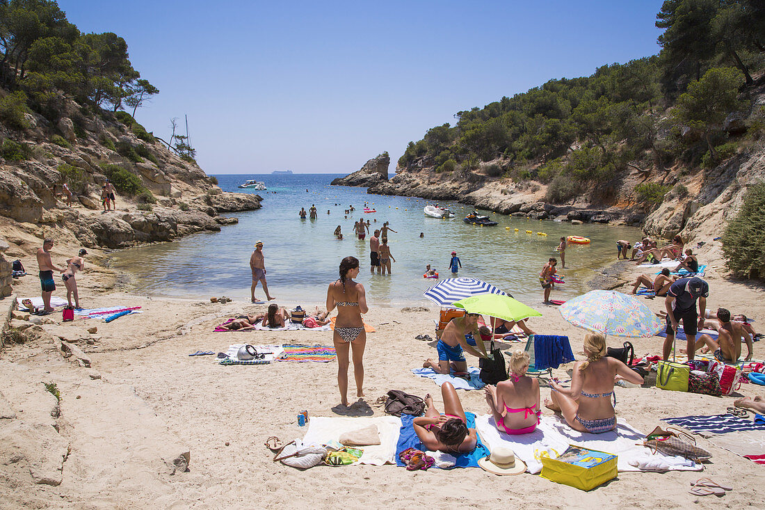 People relax on beach and swim at Cala Portals Vells bay, Portals Vells, Mallorca, Balearic Islands, Spain