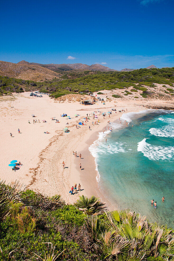 People relax and swim at Cala Torta beach, near Arta, Mallorca, Balearic Islands, Spain