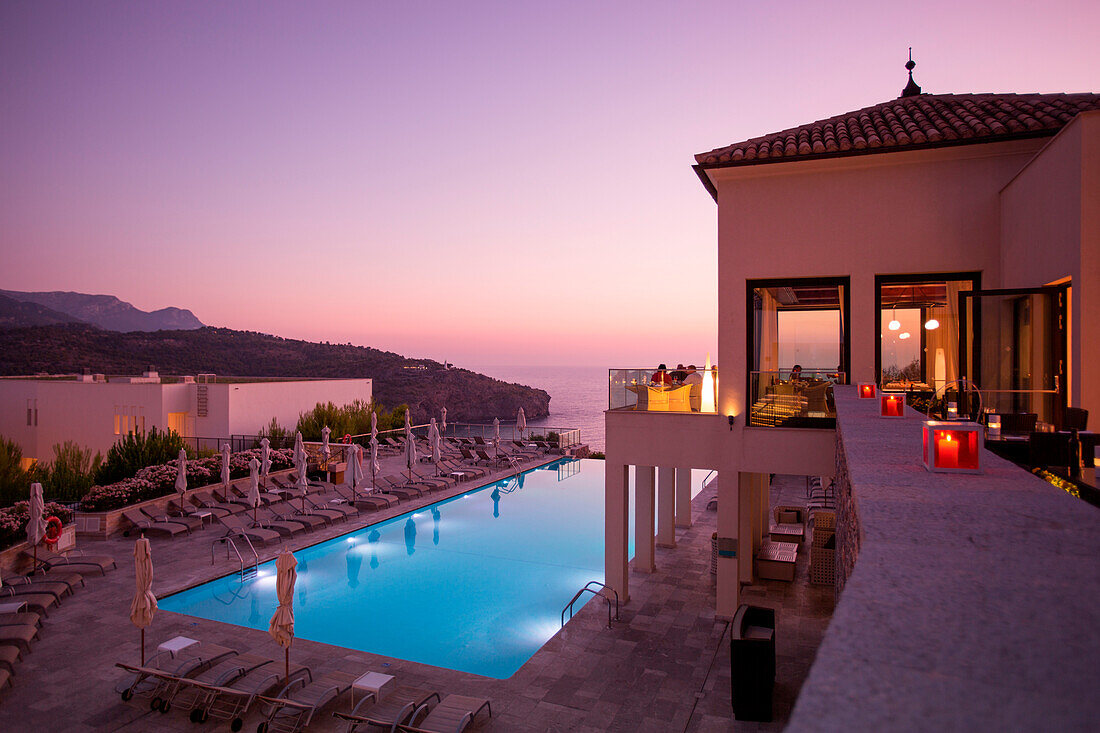 Swimming pool at Jumeirah Port Soller Hotel & Spa at sunset, Port Soller, Mallorca, Balearic Islands, Spain