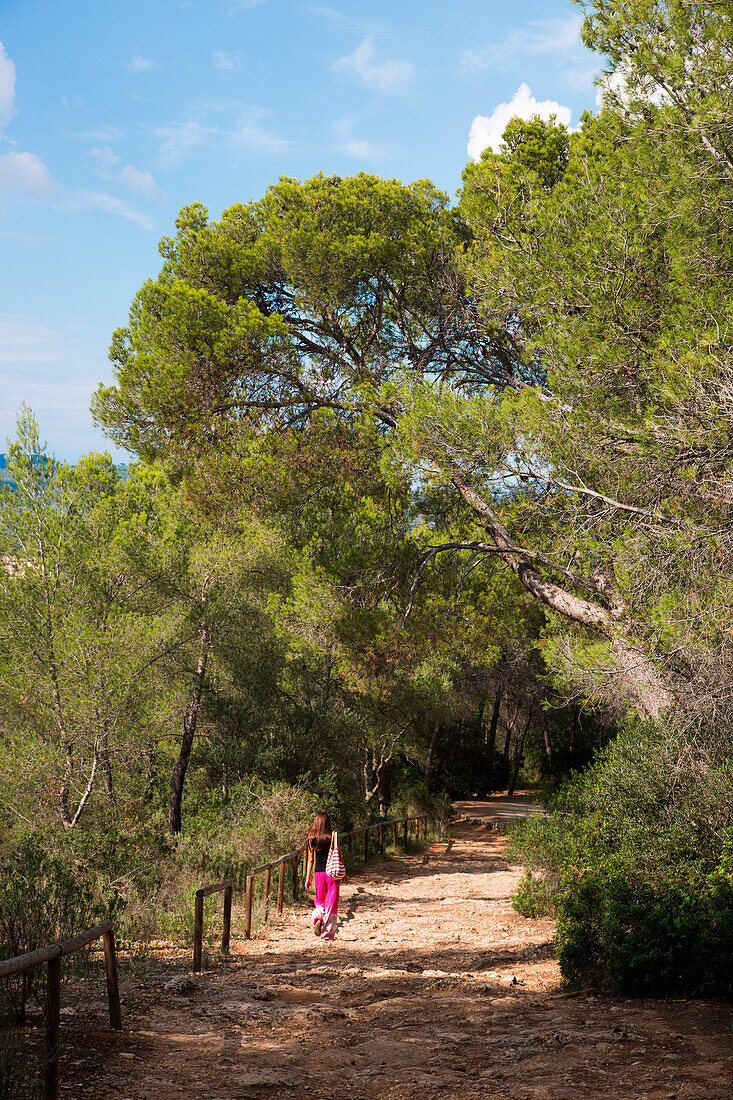 Young woman on hiking path near Castell de Bellver, Palma, Mallorca, Balearic Islands, Spain