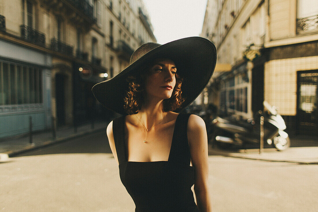 Glamorous Caucasian woman standing in city street