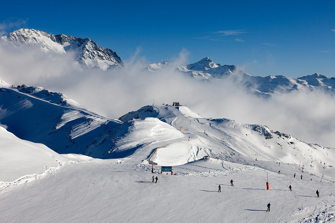 France, Savoie, Les Menuires, Val Thorens, Meribel, crossroad of the Trois Vallees ski resort from the Mont de la Chambre 2850m with view on the Aiguille de Peclet 3562m