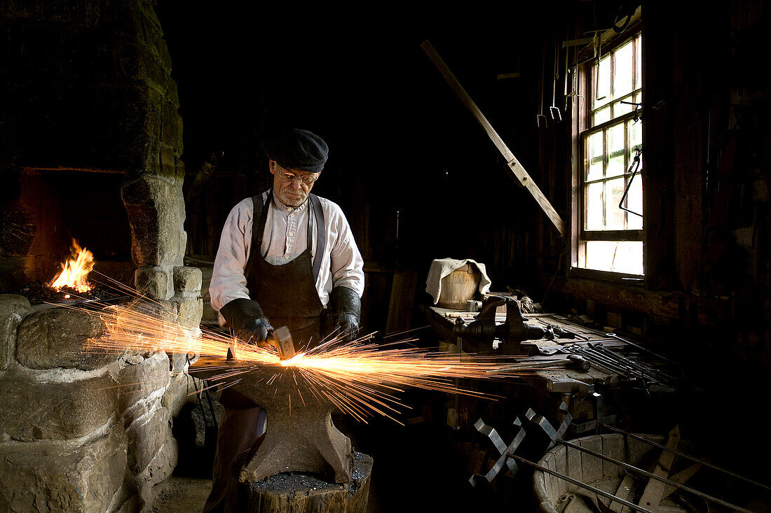 Canada, New Brunswick, the Acadian coast, the Acadian historic village of Caraquet, blacksmith at work