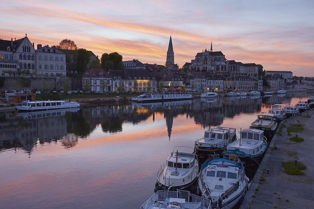 View across the river Yonne at Saint-Étienne Cathedral and Saint-Germain Abbey at Auxerre , Sunset , Departement Yonne , Burgundy , France , Europe