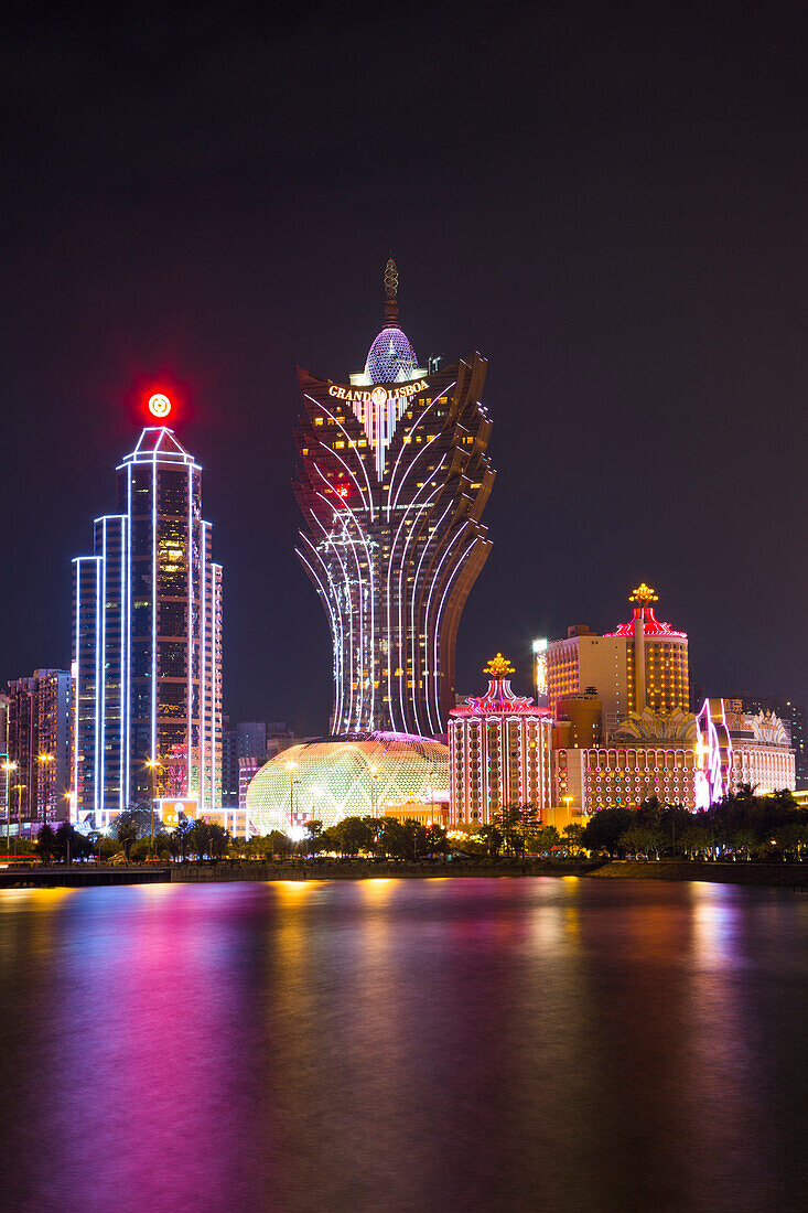 Illuminated city skyline with Grand Lisboa Hotel & Casino at night, Macau, Macau, China
