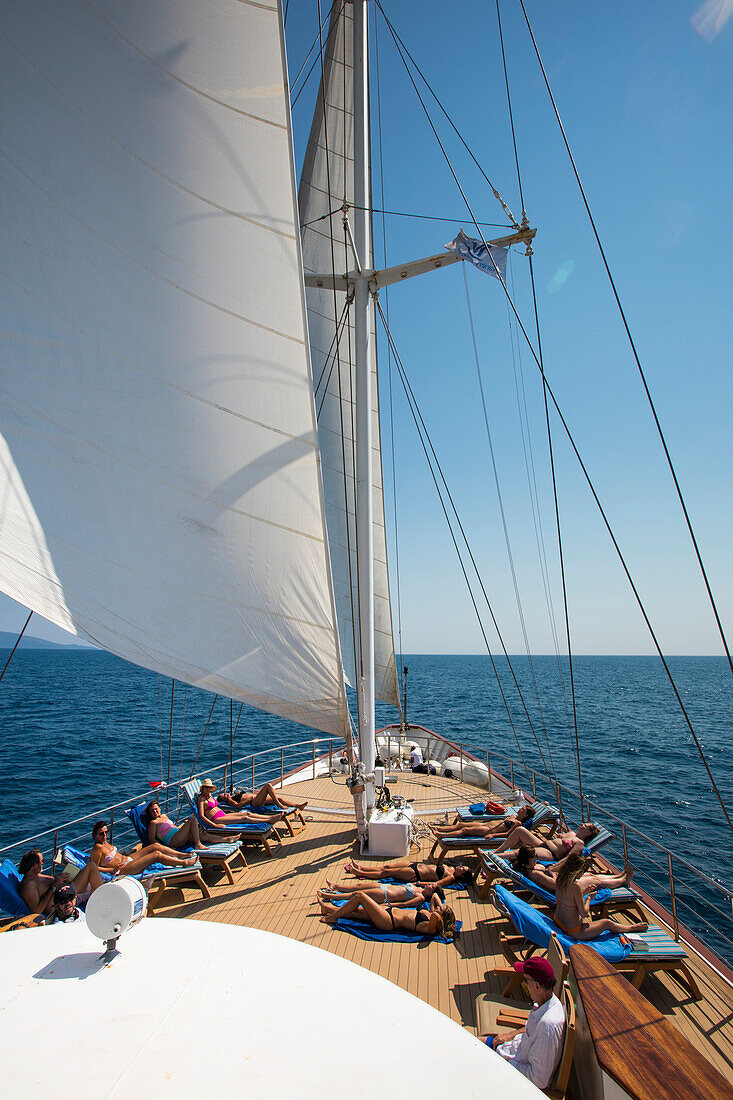 Passengers relax on deck of motor sailing cruise ship M/S Panorama (Variety Cruises), Adriatic Sea, near Albania