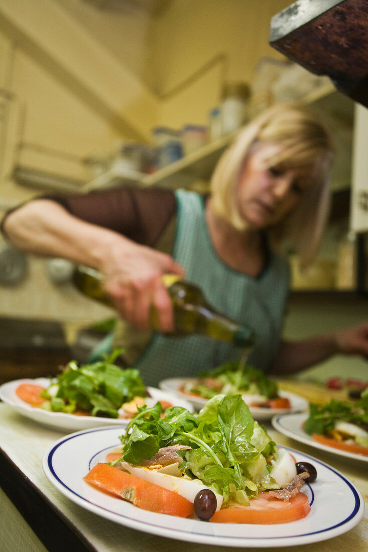France, Alpes Maritimes, Nice, Old Town, Chez Palmyre Restaurant, preparation of the salad Nicoise