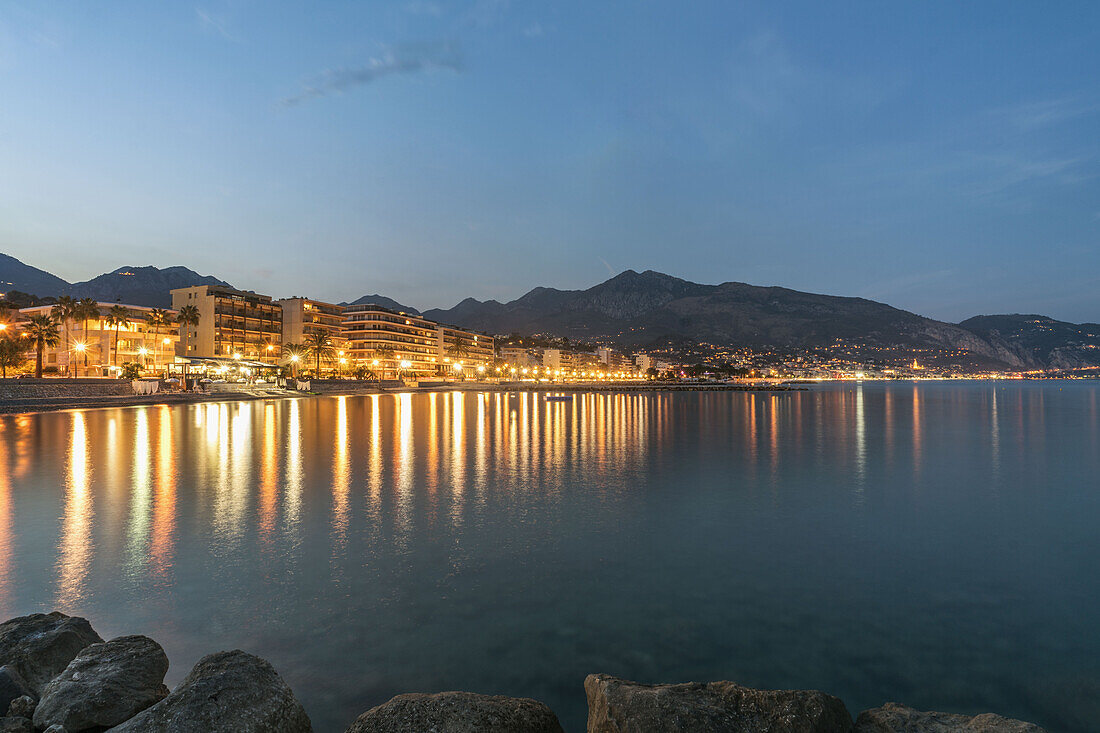 Promenade du Cap Martin , background Menton at twilight, Roquebrune-Cap-Martin, Cote d Azur, France