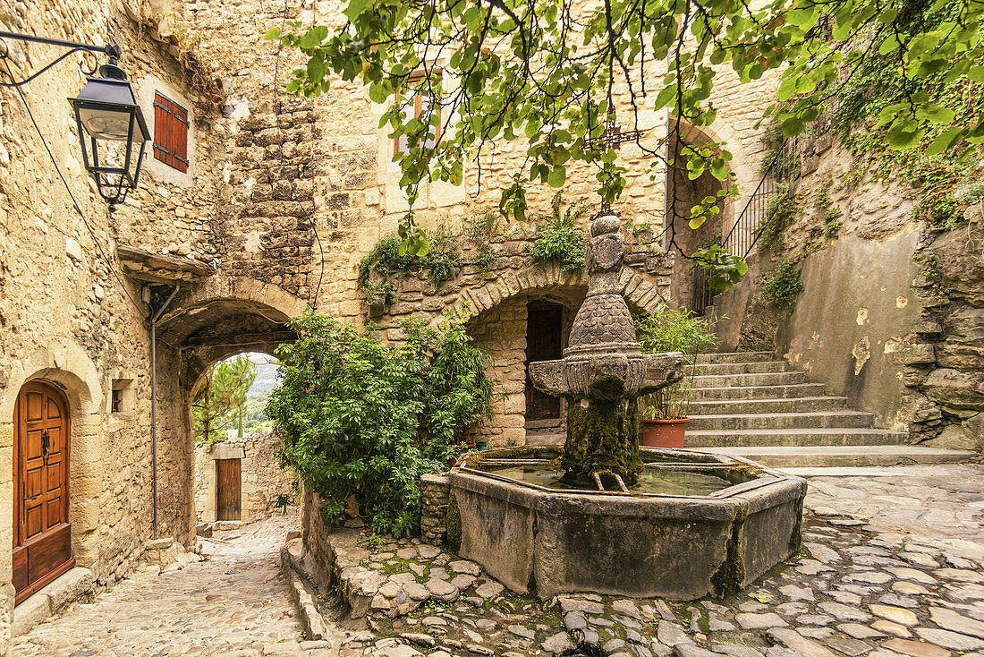 Historic Fountain in courtyard, Le Crestet, Vaucluse, France, Europe