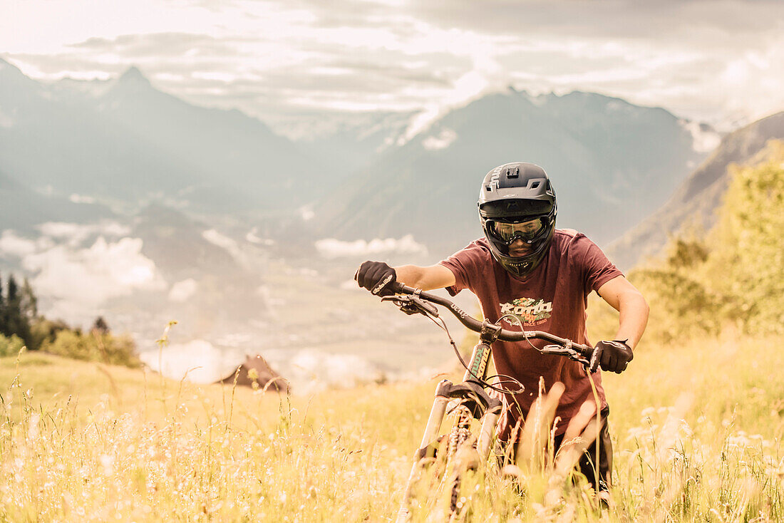 Mountainbiker within the mountains at sunrise, Brandnertal, Vorarlberg, Austria, Alps, Mountains, Downhill