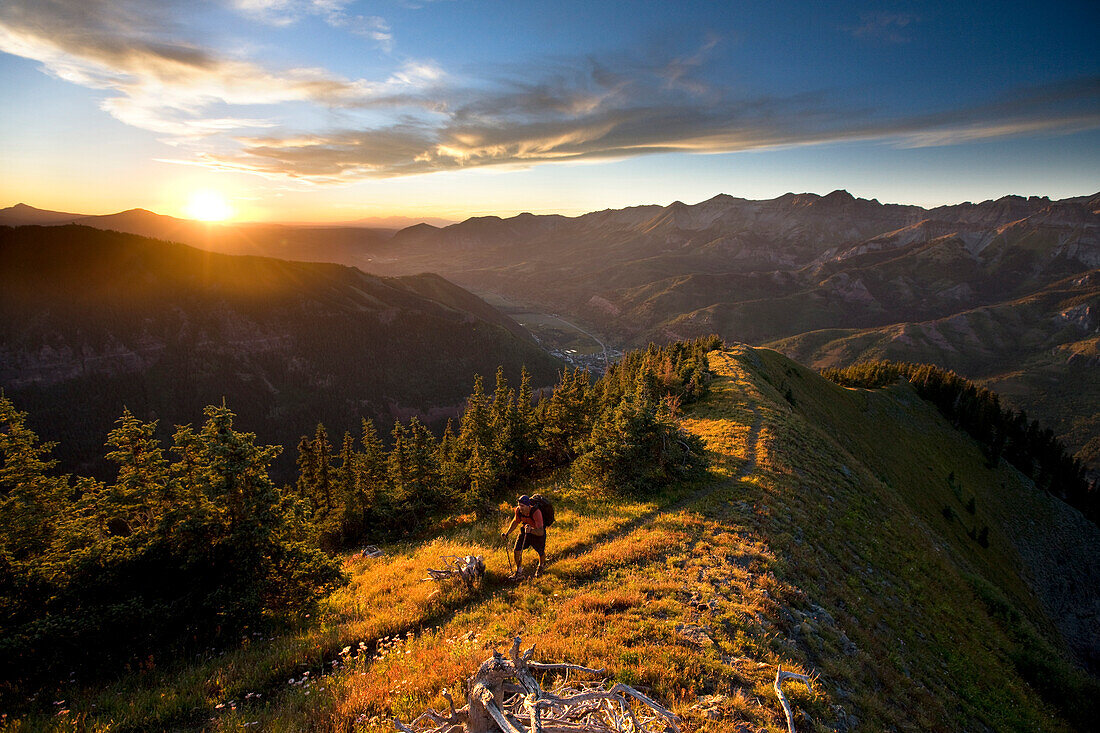 Whit Richardson hiking up Ballard mountain, Telluride, Colorado.