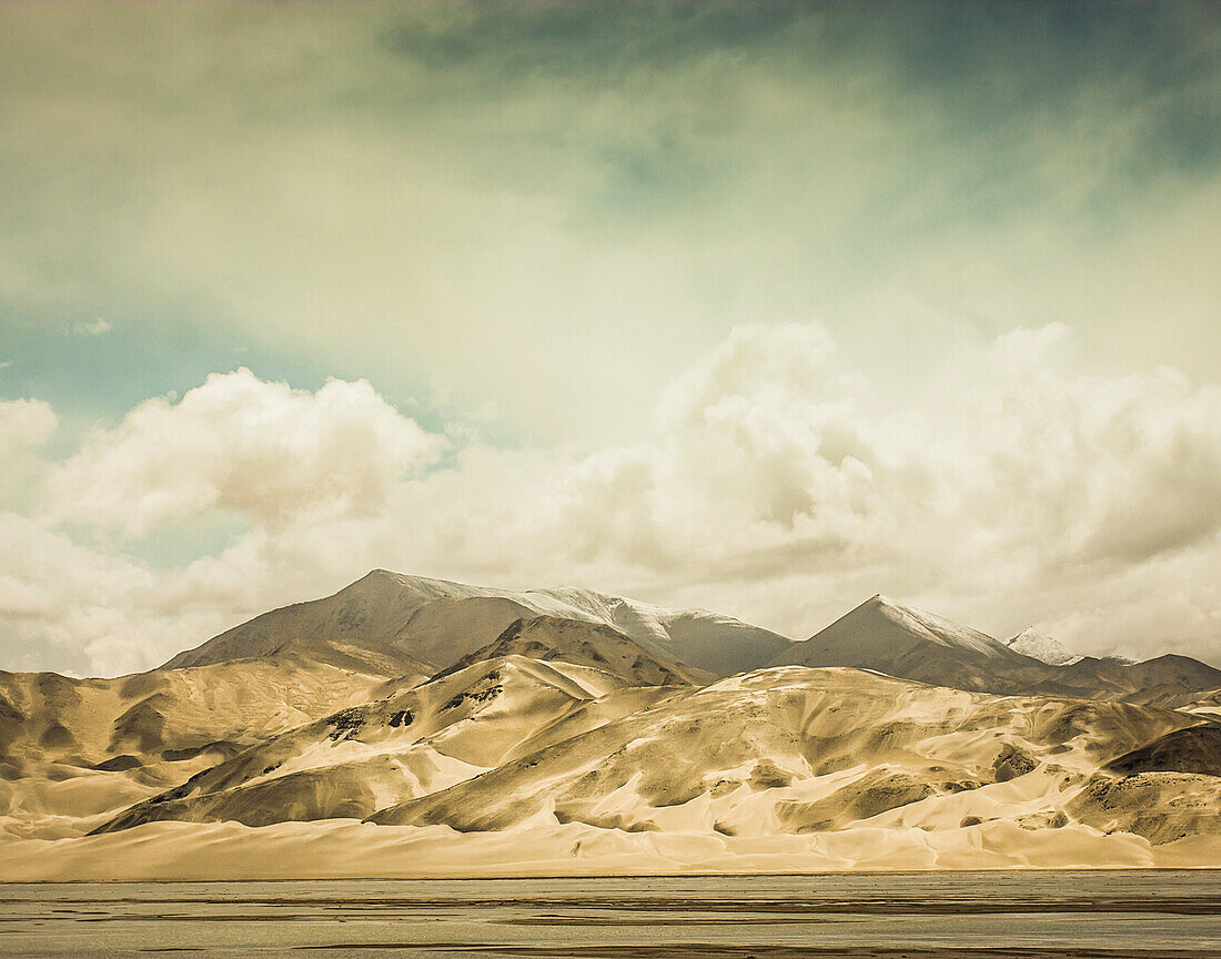 Desert mountains with permanent snow at their tops in far western China.