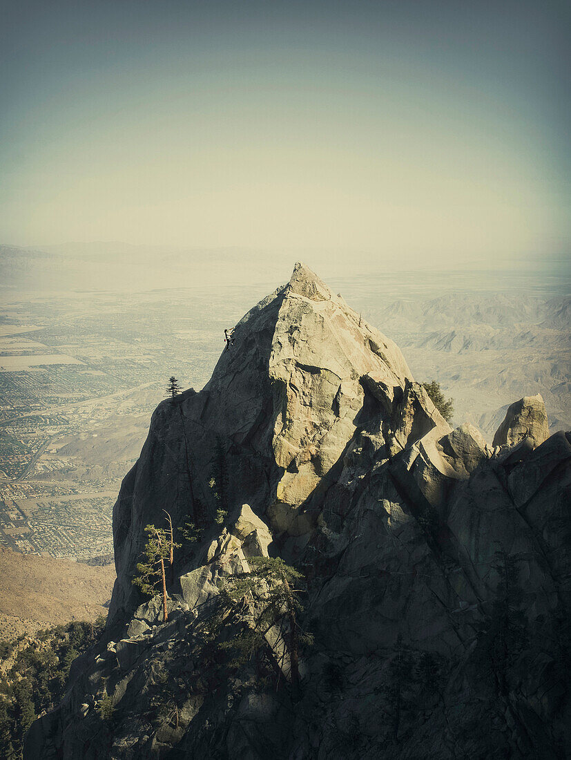 A man climbs a mountain in San Jacinto State Park near Palm Springs, California.