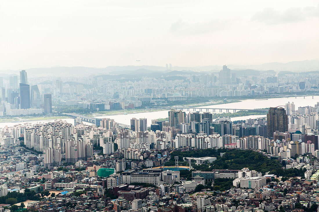 The panoramic view from the Seoul Tower over looks the city from atop of a tall mountain in the center of the city. Miles can be seen from the vantage point.