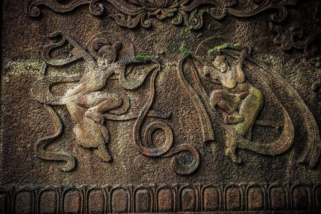 Scenes from the Buddha's life carved into the side of a mountain in Leshan, China.