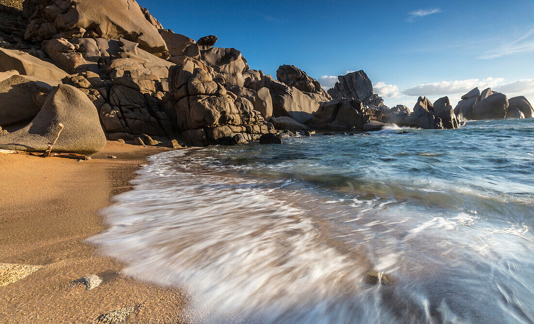 Waves crashing on the sandy beach framed by cliffs, Capo Testa, Santa Teresa di Gallura, Province of Sassari, Sardinia, Italy, Mediterranean, Europe