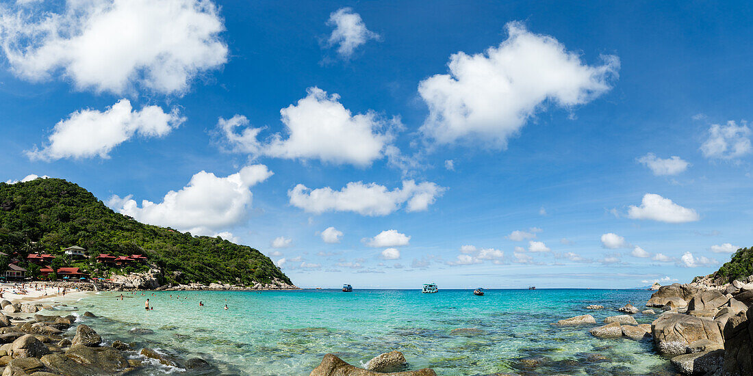 Toursits enjoy the clear water and sun at a beach on the Thai island of Koh Tao, Thailand, Southeast Asia, Asia