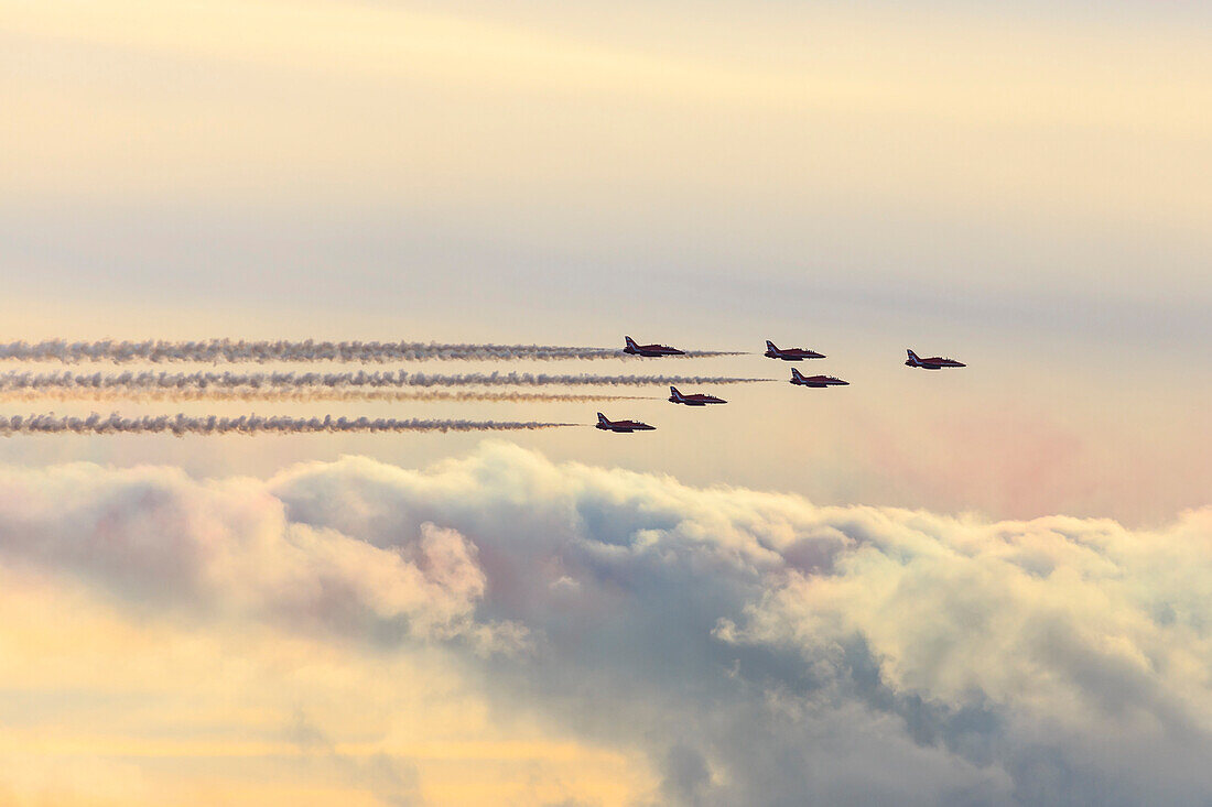 Red Arrows, Royal Air Force aerobatic display team, with colourful sky, England, United Kingdom, Europe