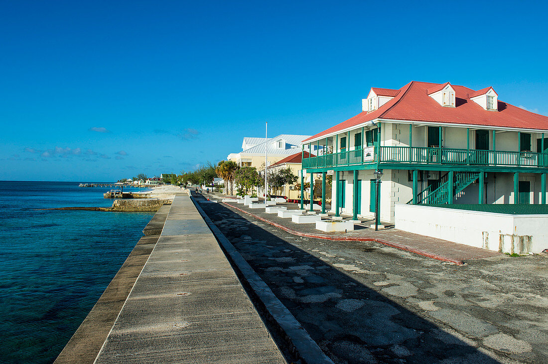 View of the beachfront with the colonial houses of Cockburn Town, Grand Turk, Turks and Caicos, Caribbean, Central America