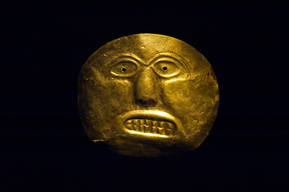 An ancient gold mask at the Museo Del Oro, Bogota, Colombia, South America