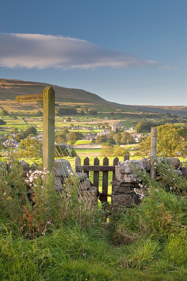 A footpath signpost and gate leading to Hawes village in Wensleydale, The Yorkshire Dales, Yorkshire, England, United Kingdom, Europe
