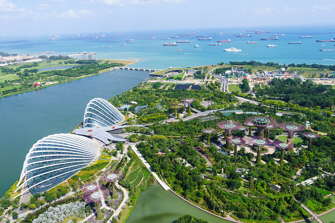 High view overlooking the Gardens by the Bay botanical gardens with its conservatories and Supertree Grove, Singapore, Southeast Asia, Asia