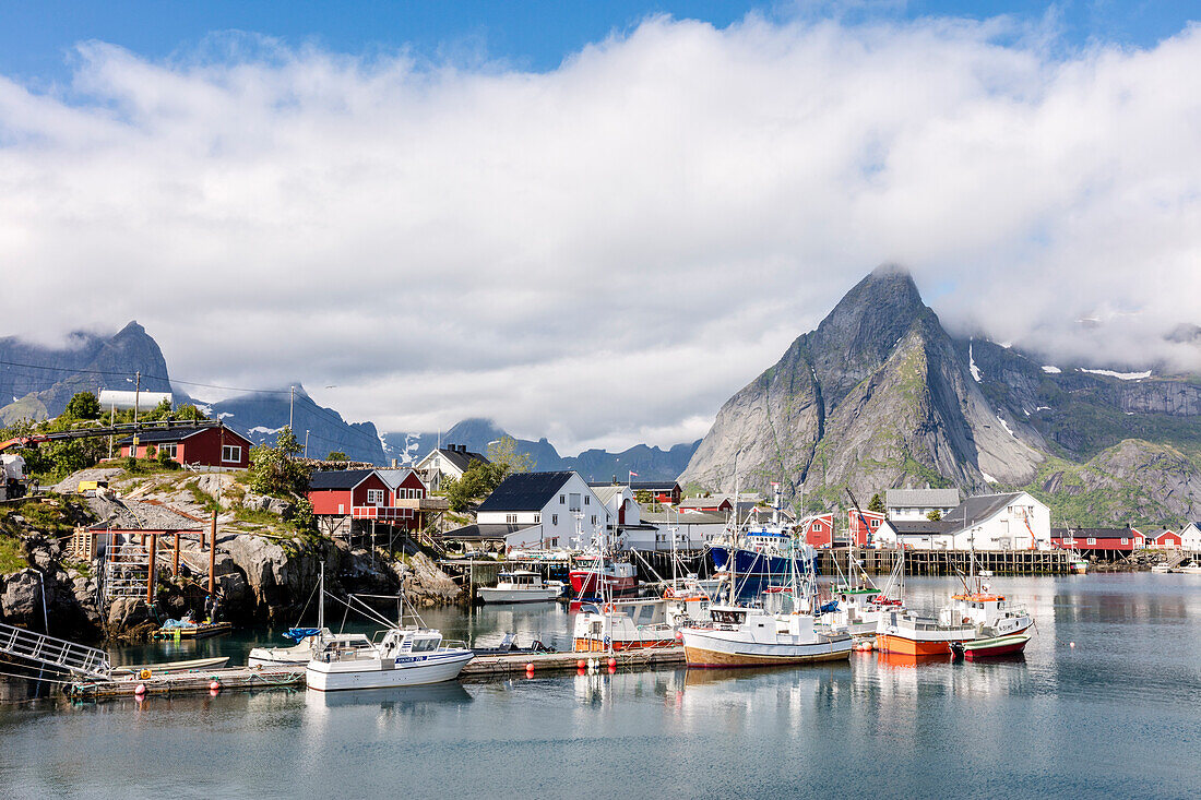 Fishing village and harbour framed by peaks and sea, Hamnoy, Moskenes, Nordland county, Lofoten Islands, Arctic, Northern Norway, Scandinavia, Europe