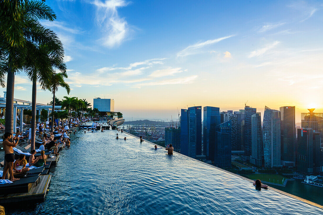 Infinity pool on the roof of the Marina Bay Sands Hotel with spectacular views over the Singapore skyline at sunset, Singapore, Southeast Asia, Asia
